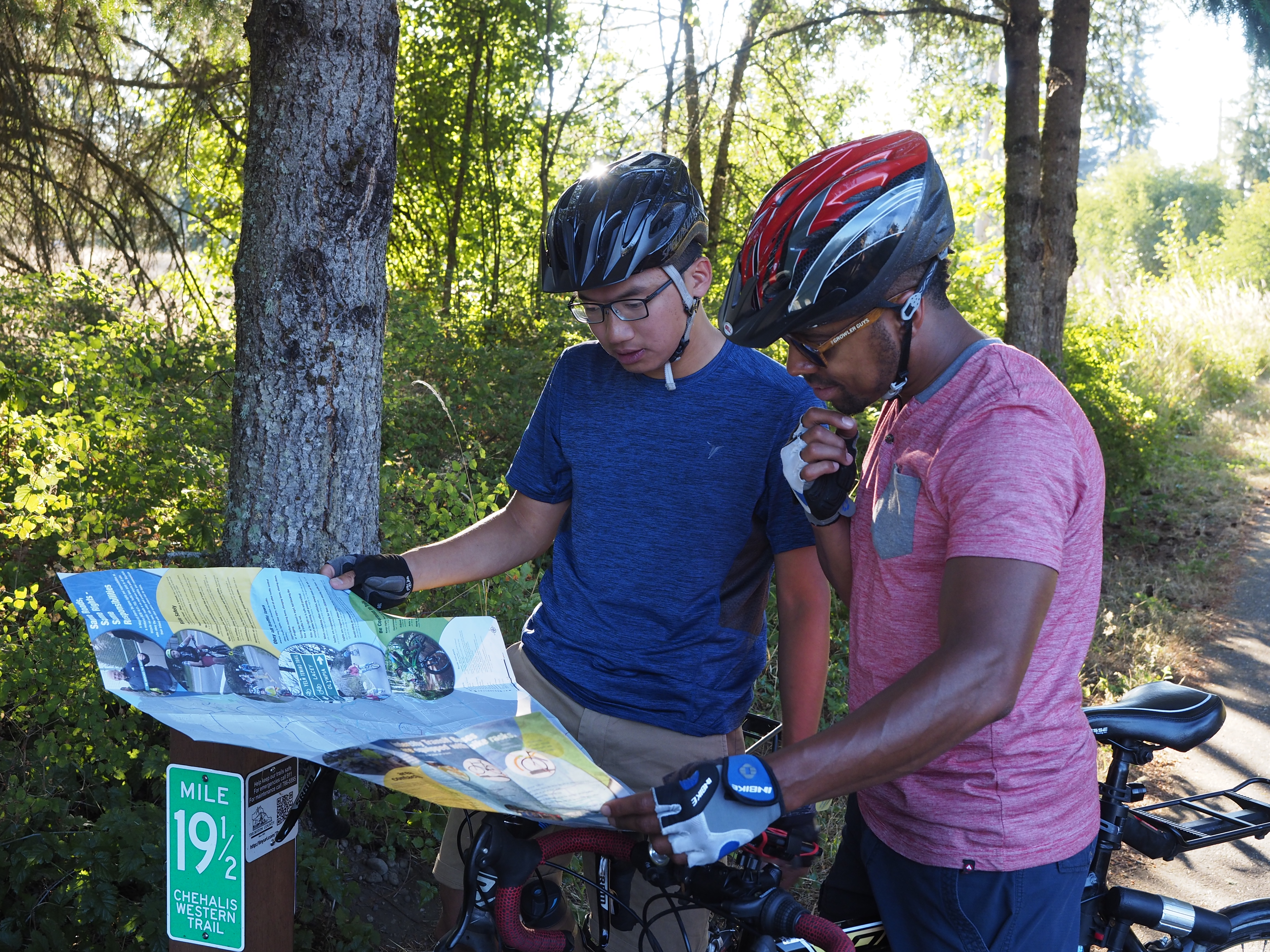 Photo of rders checking local bike map