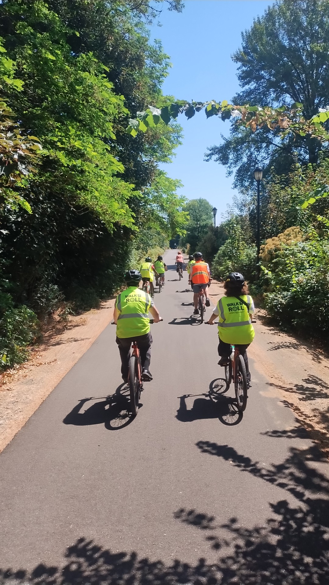 Youth biking on paved trail.